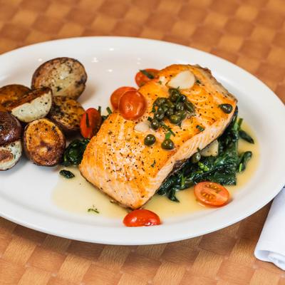 Grilled salmon with roasted potatoes and spinach.