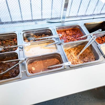 Food  bar compartments with various ingredients.