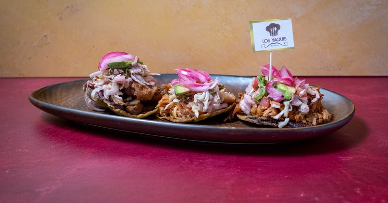 Fried tortillas topped with veggies