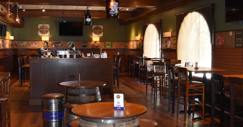 Interior, seating area, whiskey barrel tables, and beer keg stools