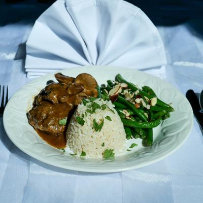 Salisbury steak with sides, served on the table.