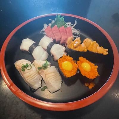 Various nigiri, sashimi, and rolls.