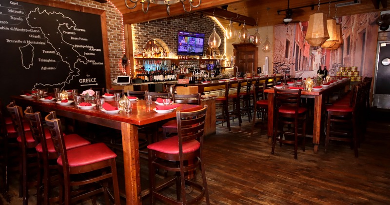 Interior, high seating area, high tables with stools for nine and thirteen people, bar