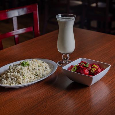 Marinated deep fried chicken with jalapenos, served with rice, and a drink.