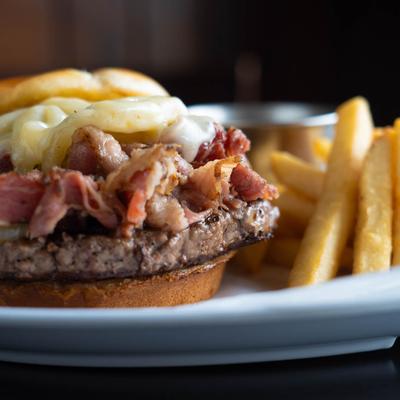 Pastrami Burger-Rare, with Fries, close up.