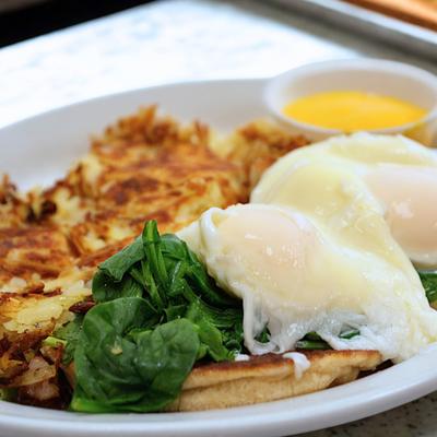 Poached eggs, spinach, and hash browns.