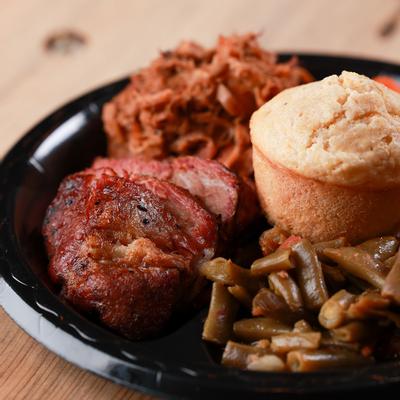Cornbread, grilled meat and vegetables on the side