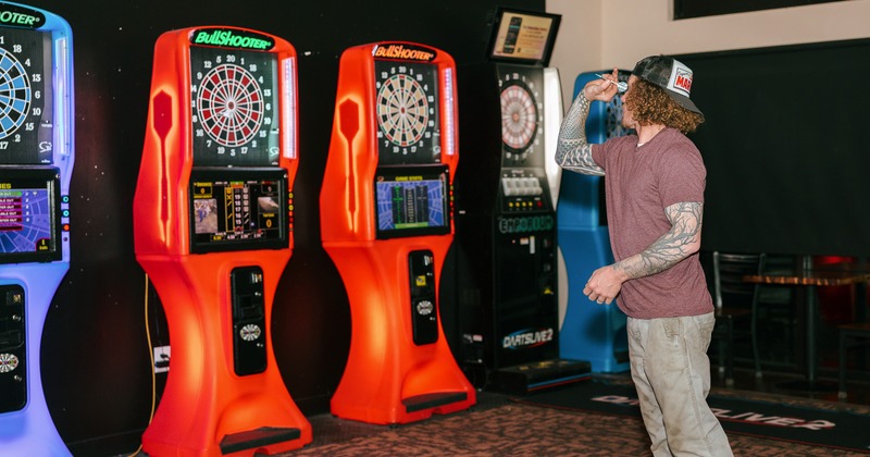 Man playing darts