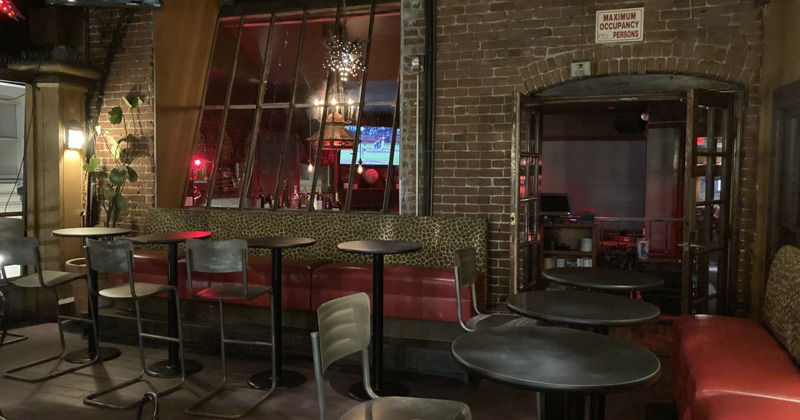 Outside dining area at night, tables and chairs