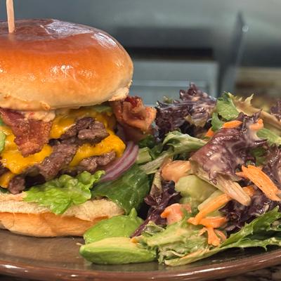 Bacon & Cheddar Burger with a side house salad.