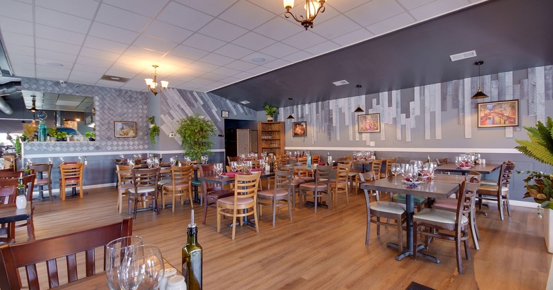 Interior, dining space with set tables