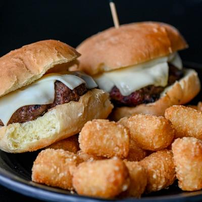 Cheeseburger Sliders served with tater tots.