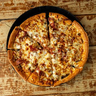 An overhead view of a pizza topped with melted cheese, pepperoni, and sausage.