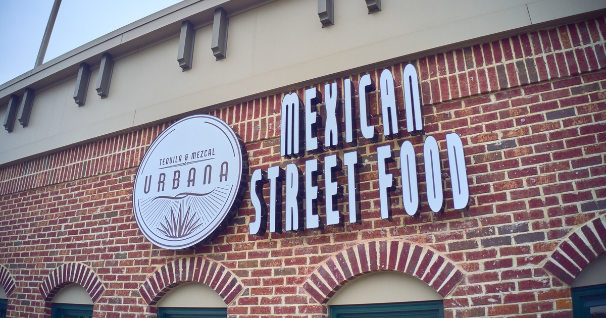 Exterior, front wall, big sign