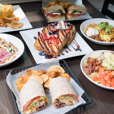 An assortment of dishes spread on a table.