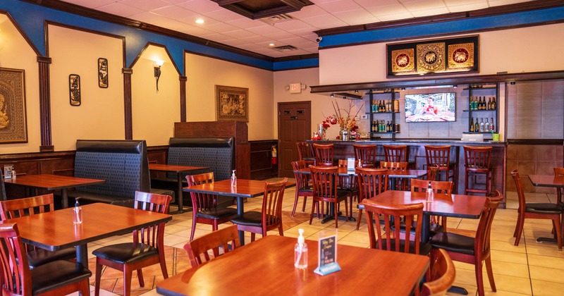 Interior seating area with chairs, booths and tables