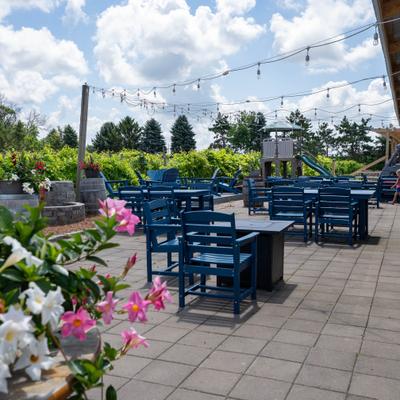 Outdoor, seating area with tables and chairs.