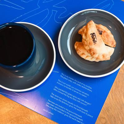 Nutella Empanadas served alongside a cup of coffee.