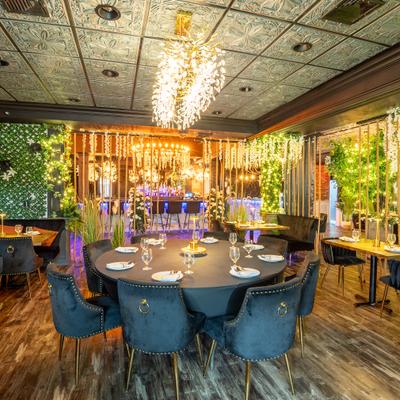 Seating area in the Main Dining Room, Large Round table, chairs.