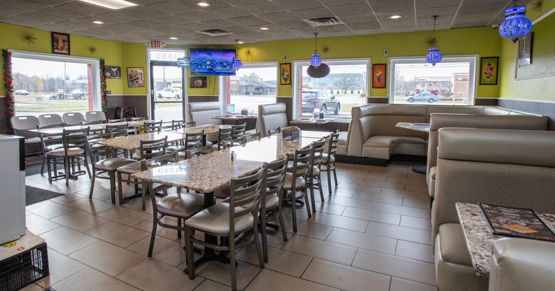 Dining area with tables and chairs and leather booths
