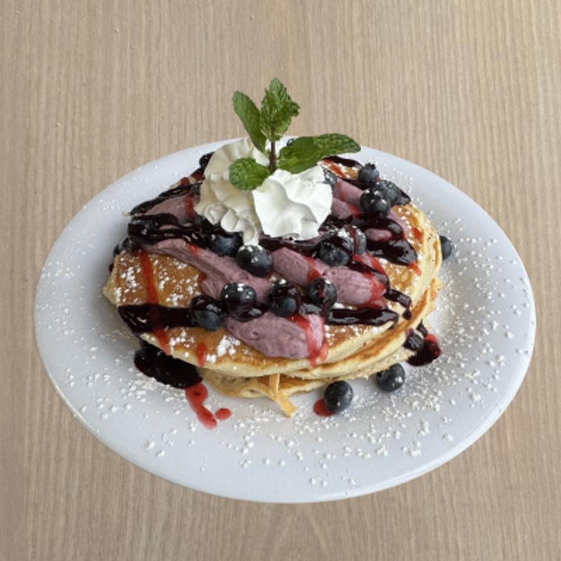 menu item 34 of 58, Blueberry Lemon Cheeseecake, blueberries, and strawberry sauce