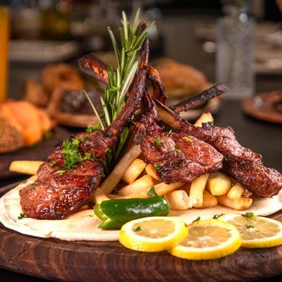 Lamb Chops served with fries.