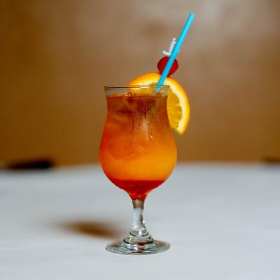 Mai Tai, with cherry and orange garnish.