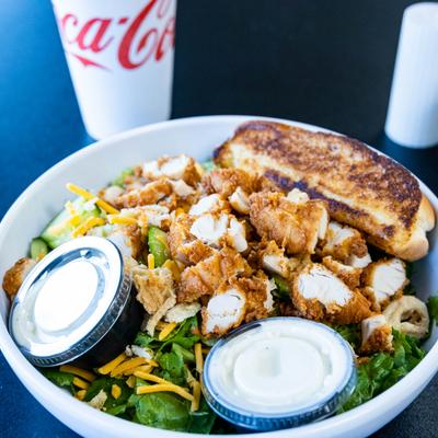 House Salad topped with chopped chicken, served with two dressings.
