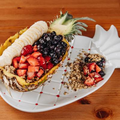 Aloha salad, served with granola and berries.