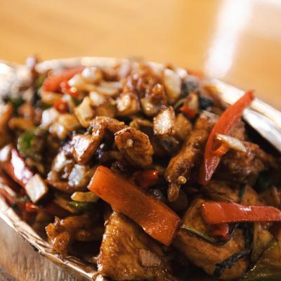 Stir fried chicken with peppers and onion.