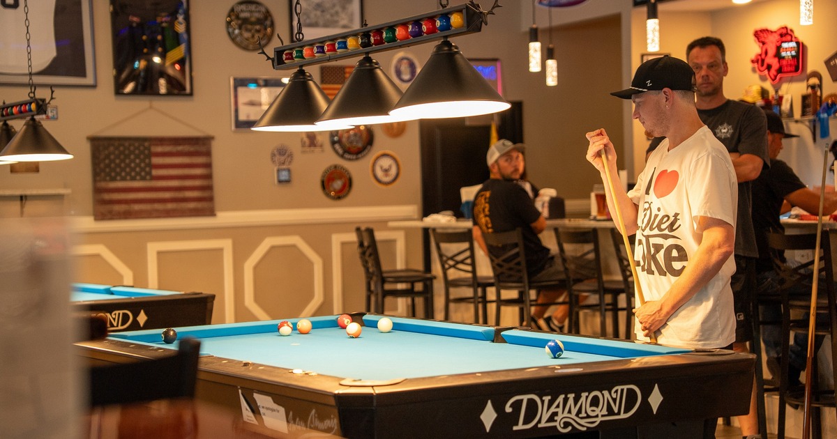 Interior, pool table with the lights above