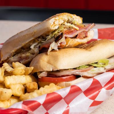 Italian sandwich served with fries.