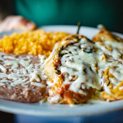 Chile Relleno with Mexican rice and refried beans on the side.