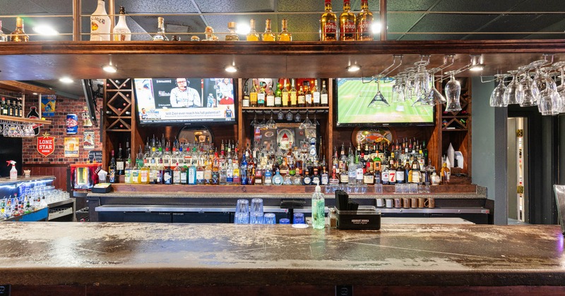 Interior, bar with TV screens above