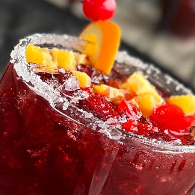 large chilled glass rimmed in sugar filled with our homemade sangria recipe voted best sangria in kansas city.