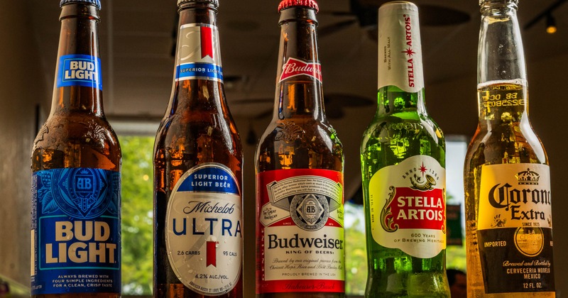 Five bottles of beer from different brands
