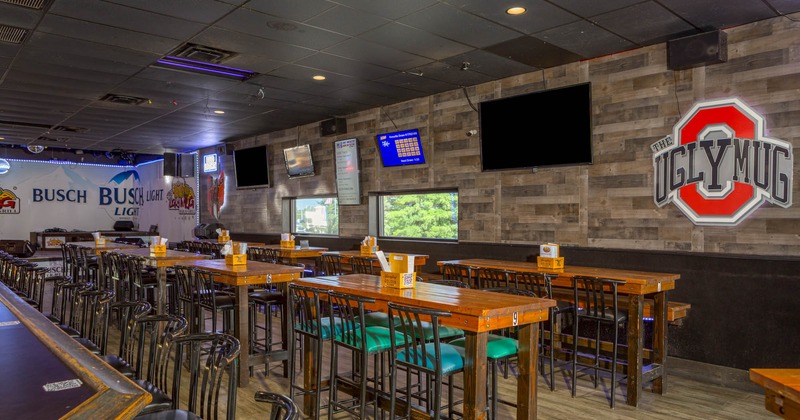 Interior, high tables and chairs ready for guests