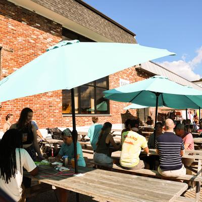 The biergarten full of people.