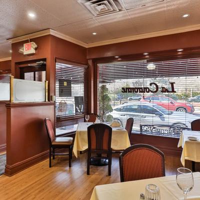 Tables and chairs by the window.