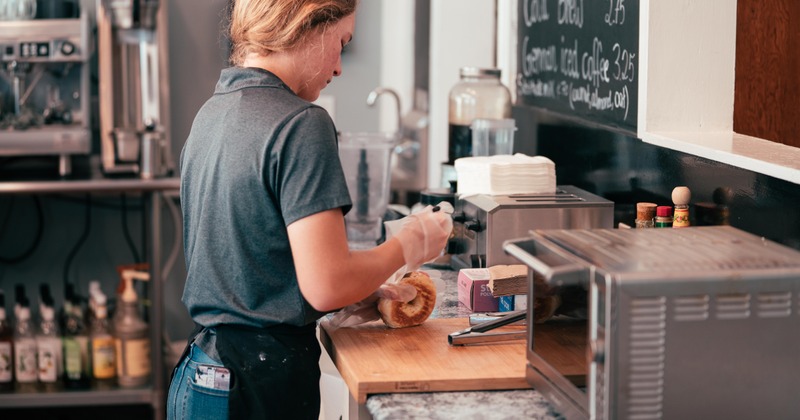 Interior, staffer in action at a coffee bar