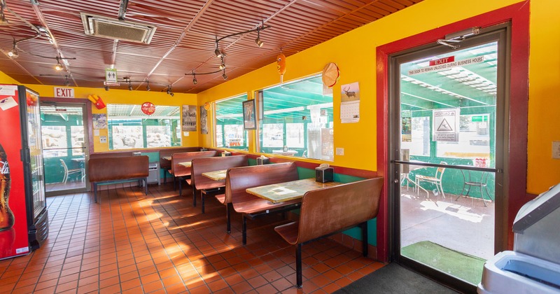 Interior, tables and seats near the entrance