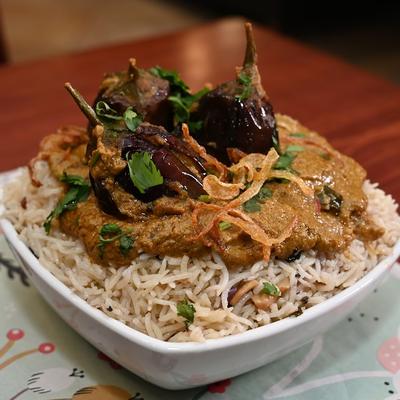 Stuffed Baby Eggplants served over aromatic rice.
