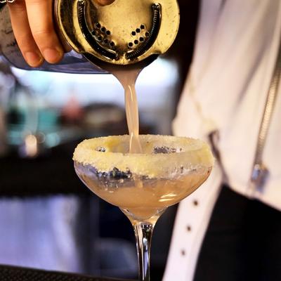 Cocktail poured into a sugar rimmed glass.