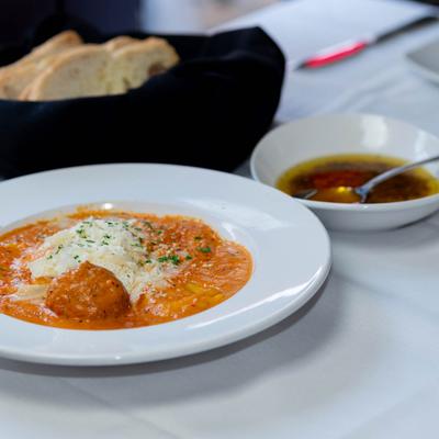 Cheese ravioli, with vodka sauce and meatball.