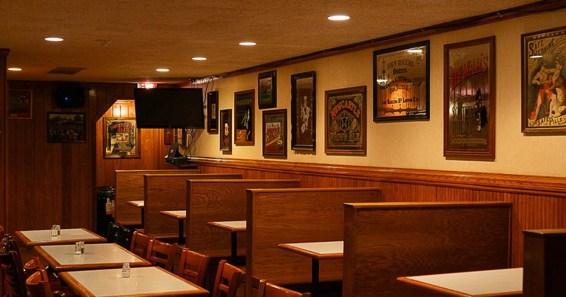 Interior, restaurant booths near wall with pictures