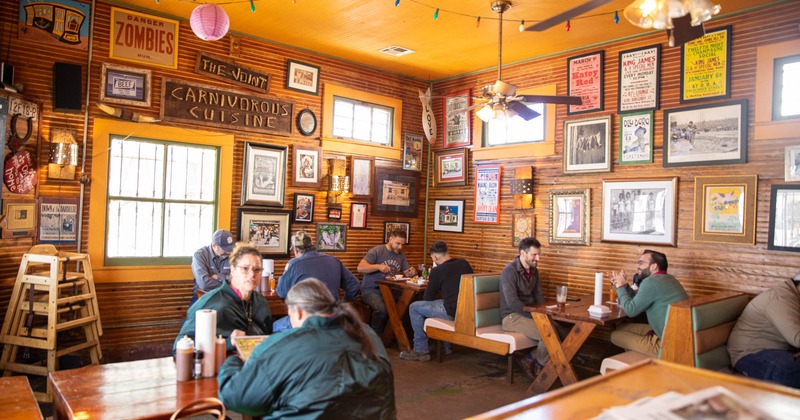 Interior, tables and chairs, guests enjoying their food and drinks
