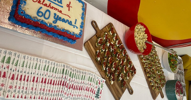 Appetizers and a cake on a table