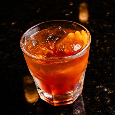An Old Fashioned cocktail served in a rocks glass.