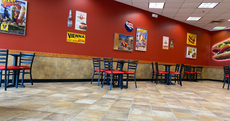 Indoor seating area next to the wall decorated with pictures