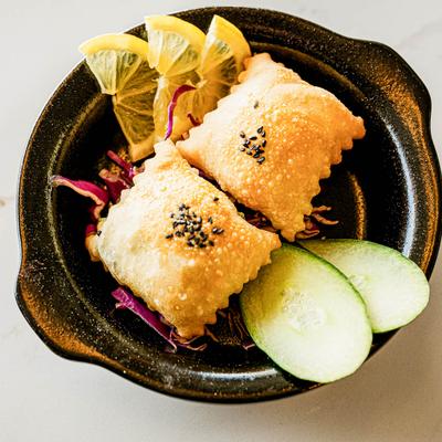 Crispy fried layers of dough dilled with cheese blend.